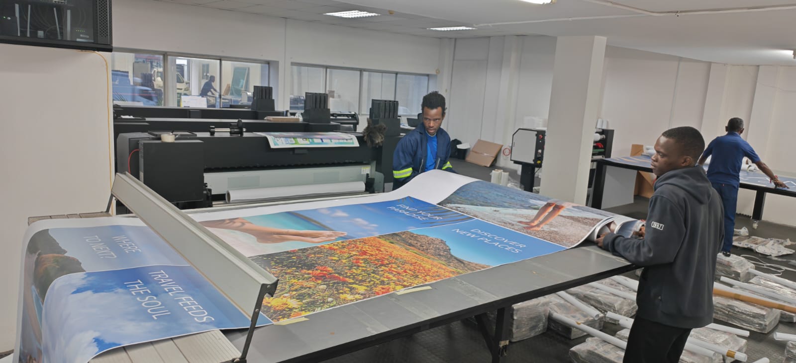 Print Scene team working on large format printed graphics